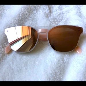 Rose Gold Illestiva sunglasses.